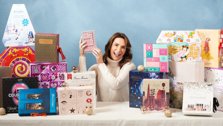 Liz surrounded by twenty 2017 advent calendars