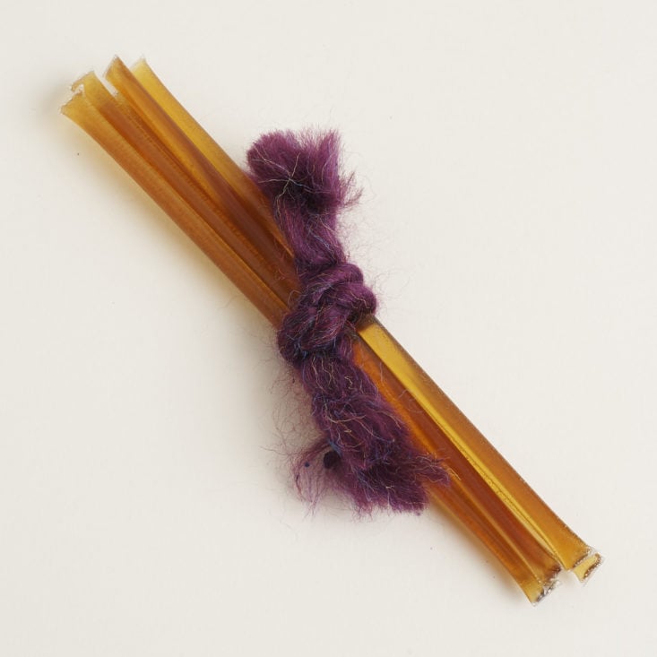 blackberry blossom honey sticks tied together with purple fabric cord