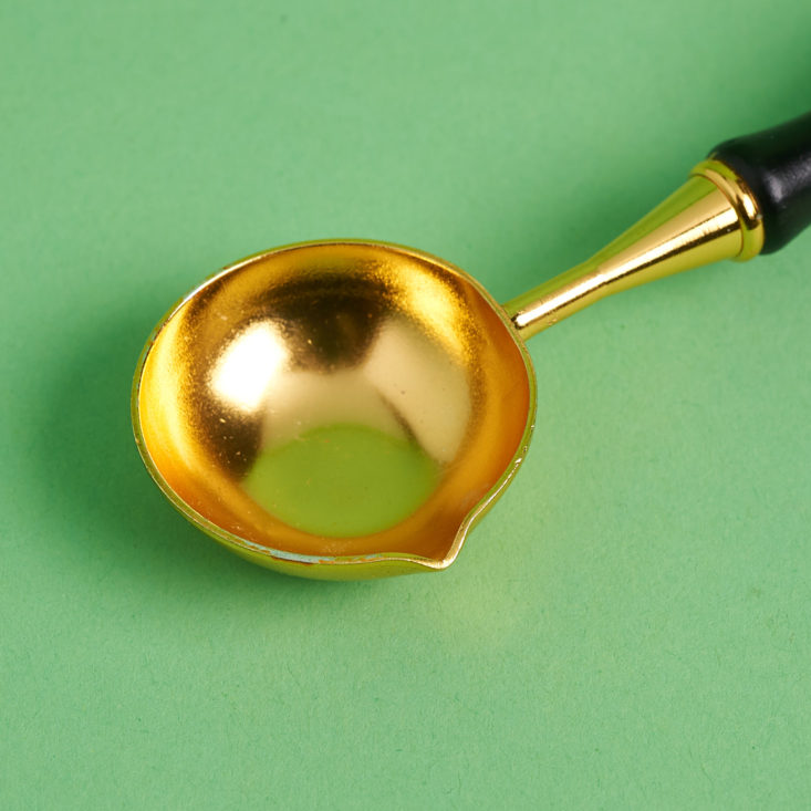 close up of wax melting spoon