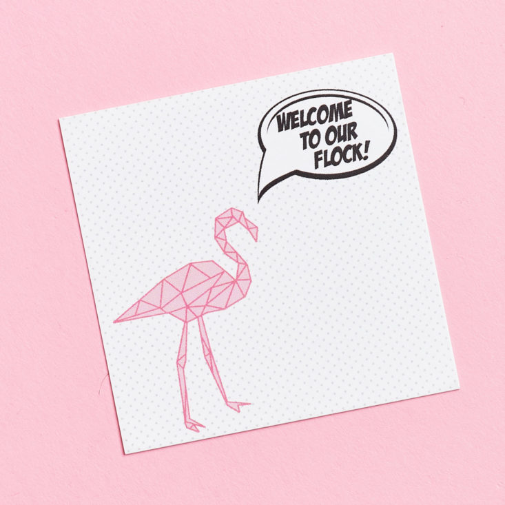 information card with flamingo on it
