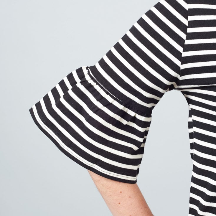 bell sleeve on striped black and white top