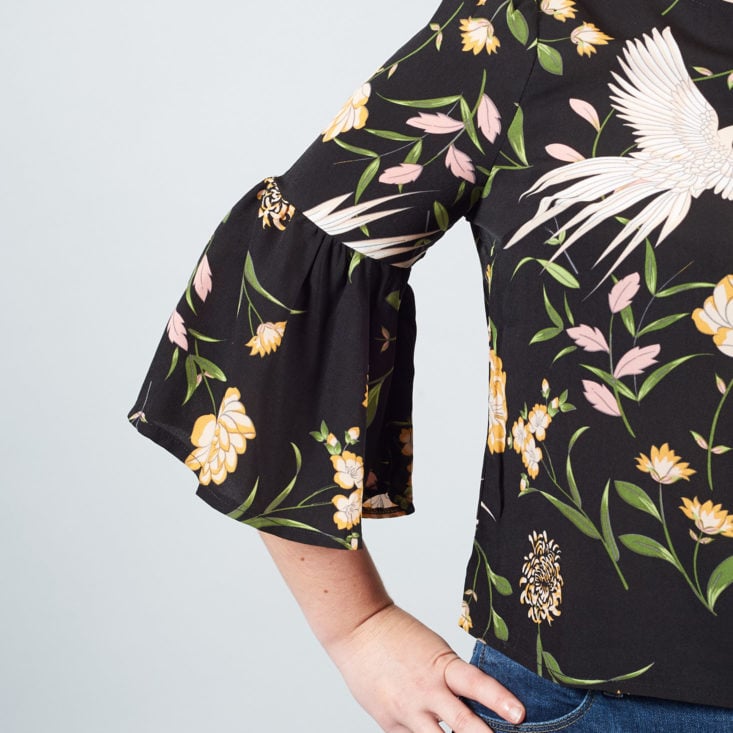 bell sleeve on crane-printed top