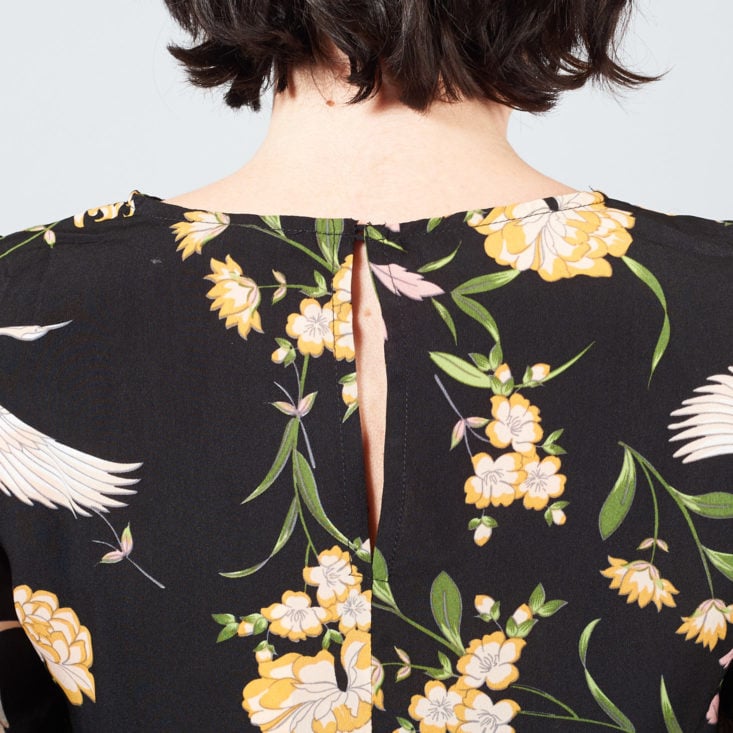 keyhole in back of crane-print top