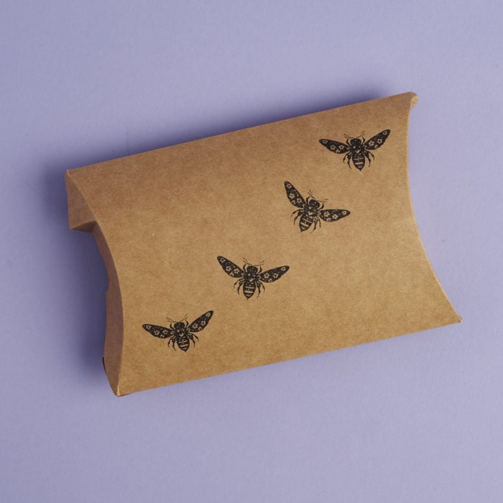 Kraft paper package with bees stamped on it