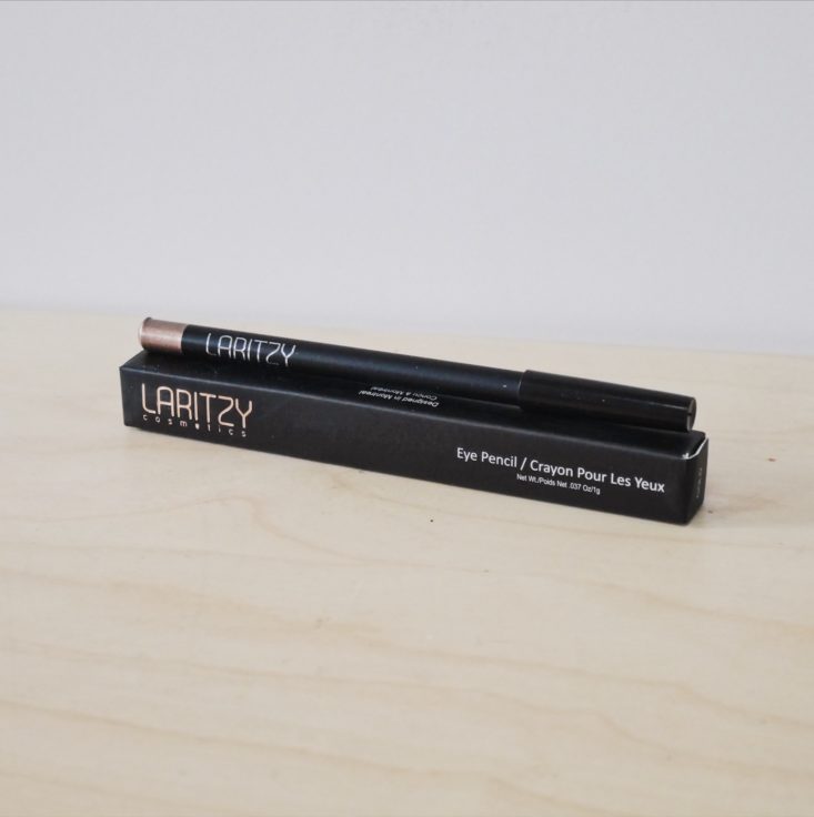 Laritzy Eye Pencil “Gold” sitting on top of box