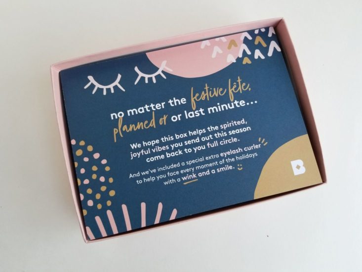 open birchbox sample box with pretty pink and navy info card