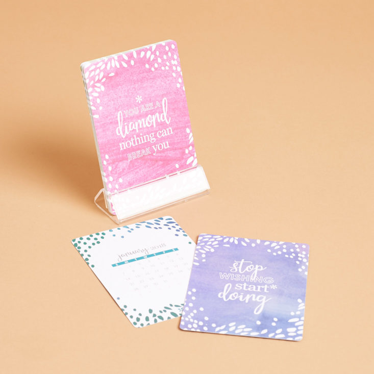 erin condren tabletop calendar with one card in the stand and two laying down