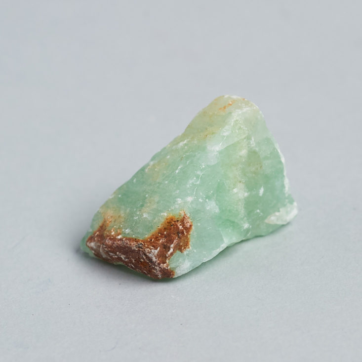 green stone with brownish edge