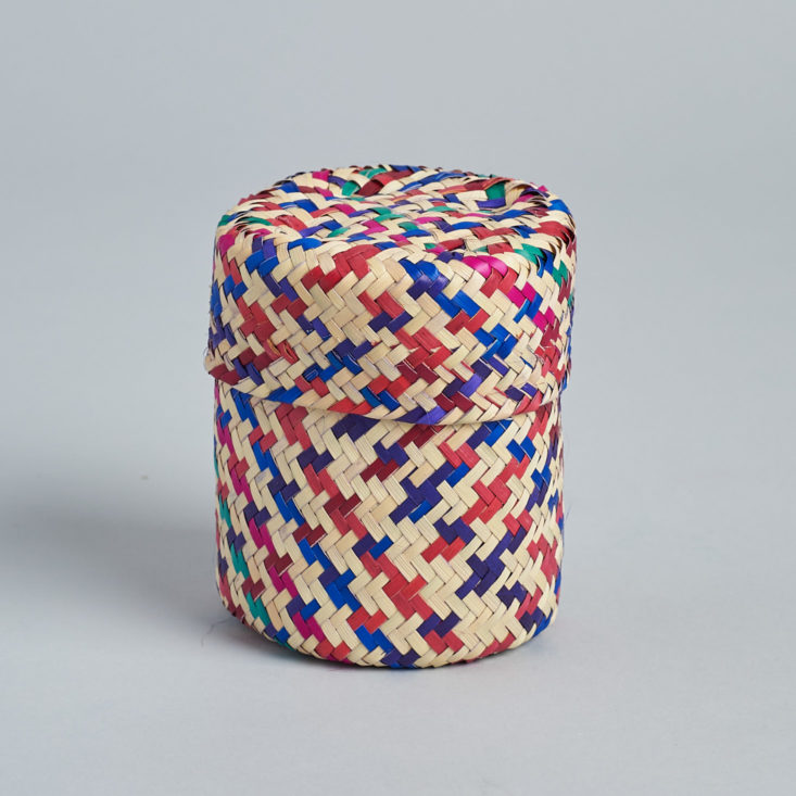 This small red and blue woven basket can be used with or without its lid.