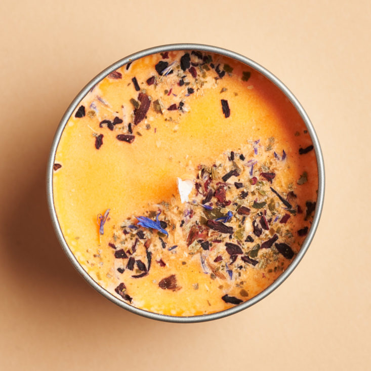 herb dusted orange candle