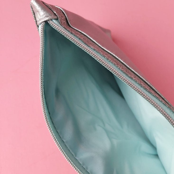 closeup of inside of metallic silver cosmetic bag from Ipsy