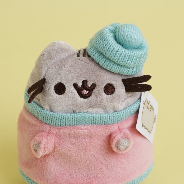 close up of Pusheen Plush in winter outfit