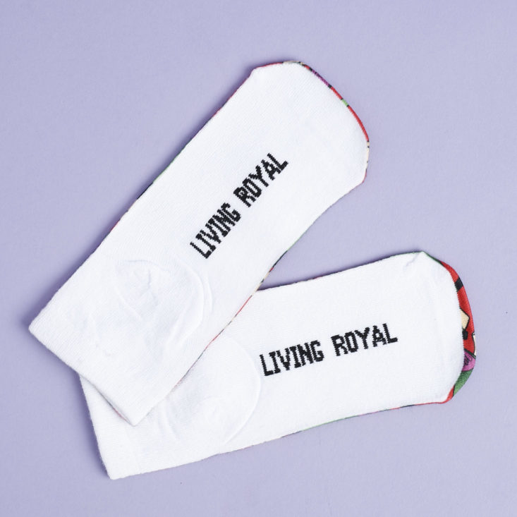 bottom of wine and cheese socks that say "living royal"
