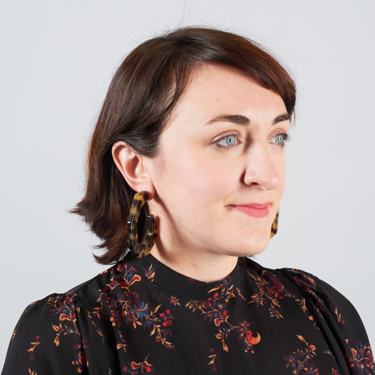 big tortoiseshell earrings on model
