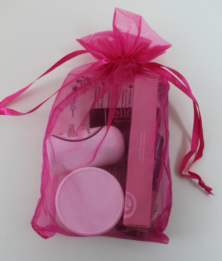 pink Organza bag filled with makeup