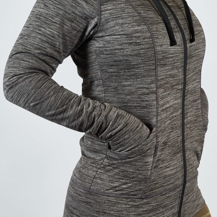 This gray winter workout jacket has handy pockets in the front