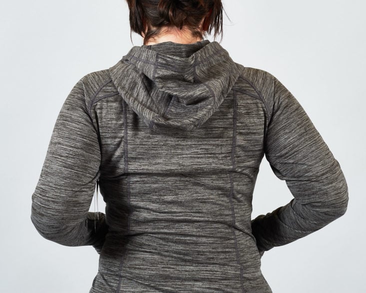 There's a hood on the back of this gray workout jacket