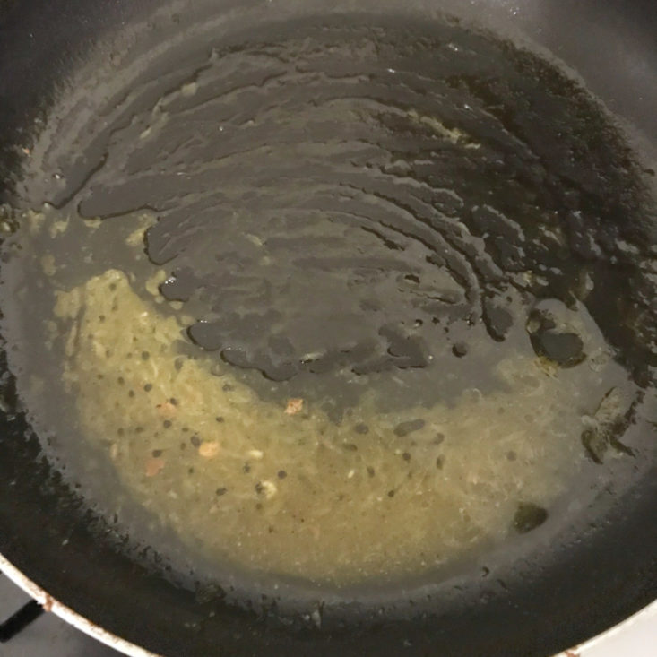 citrus vinaigrette in pan with olive oil