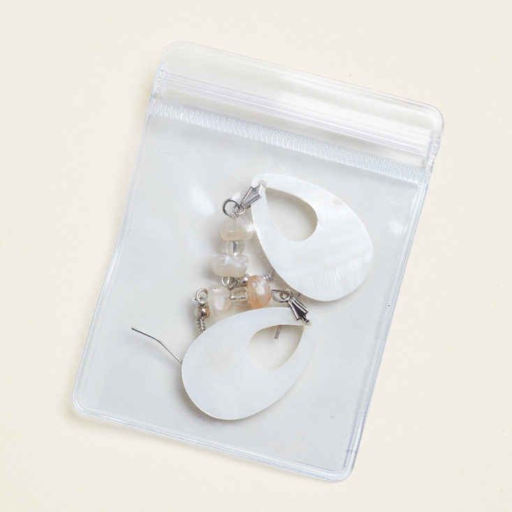 silver goddess earrings in pouch