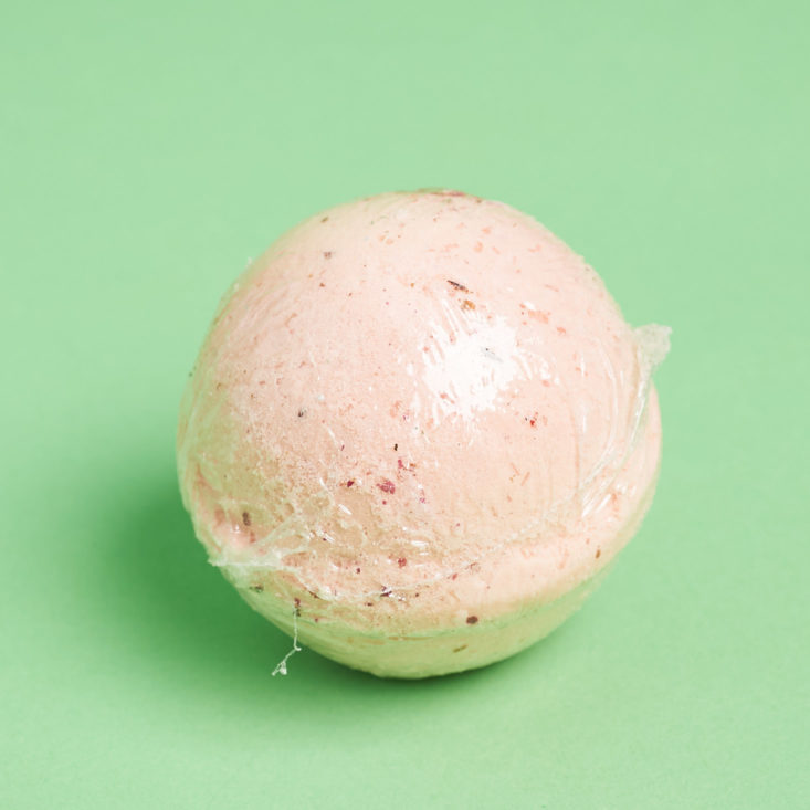 pink bath bomb in plastic wrap