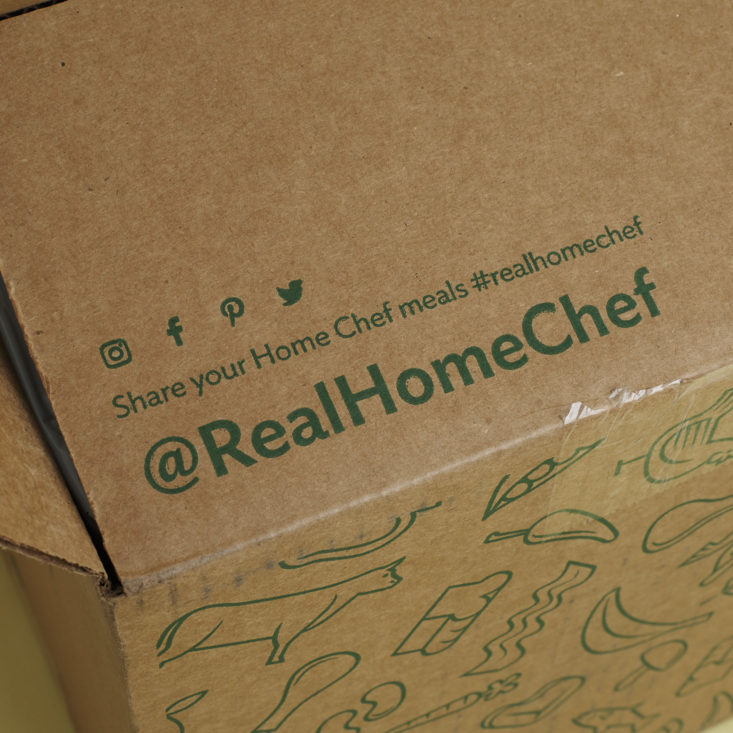 flap on home chef box with their social handle: @realhomechef