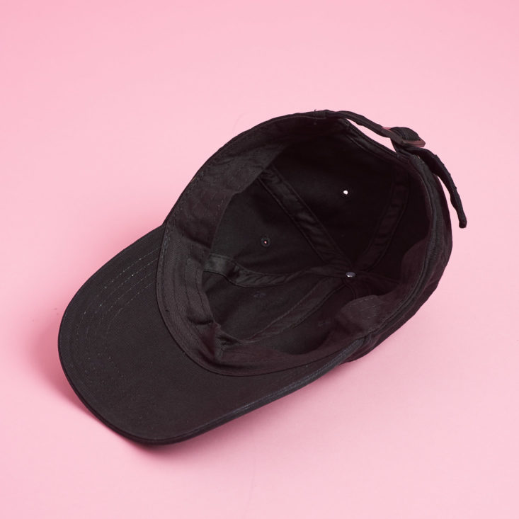 underside of a black baseball cap