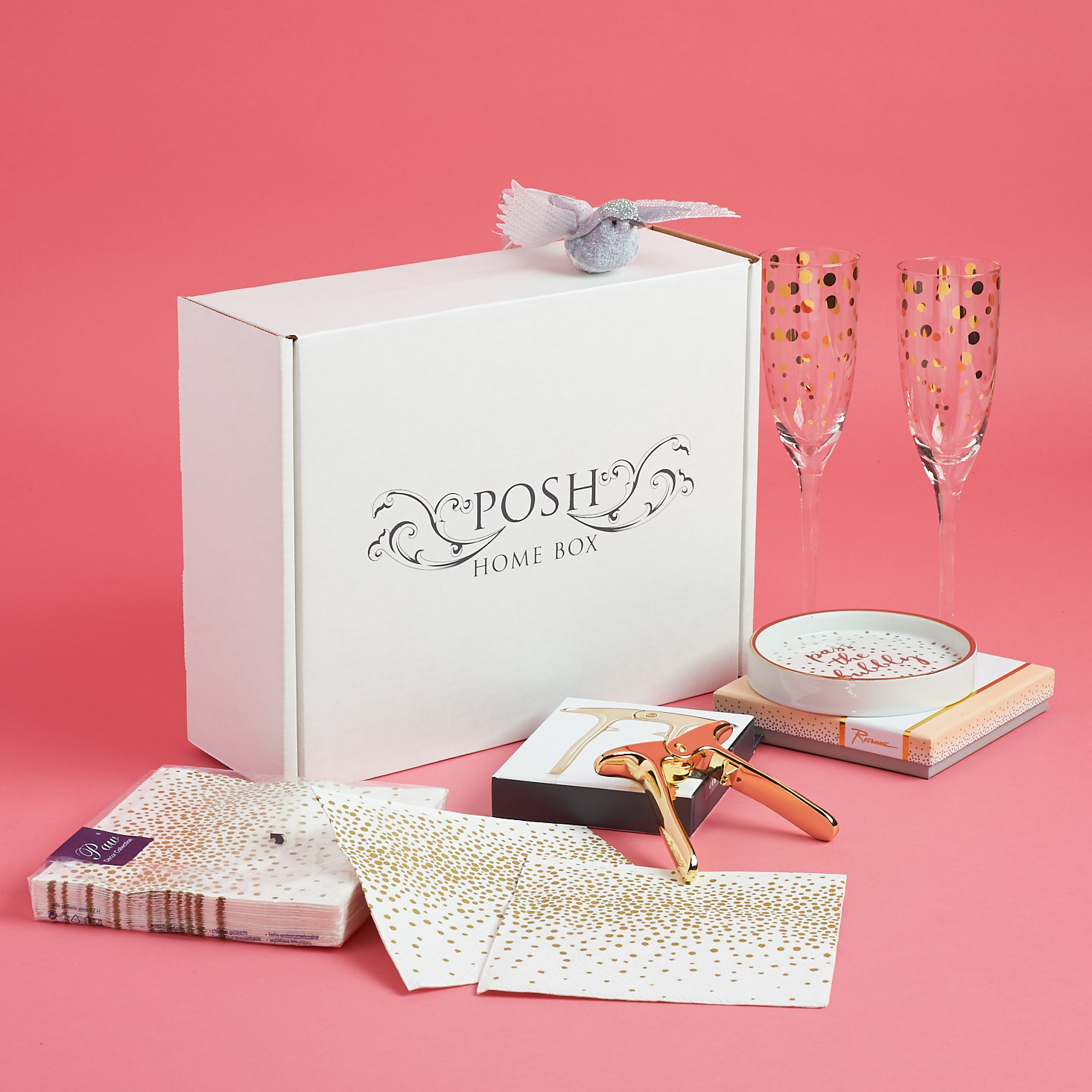 Festive wine flutes, metallic napkins, and more from the Posh Home Box.