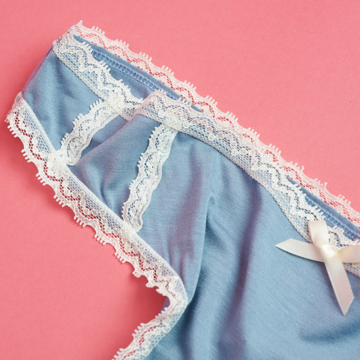 white lace trim on blue thong