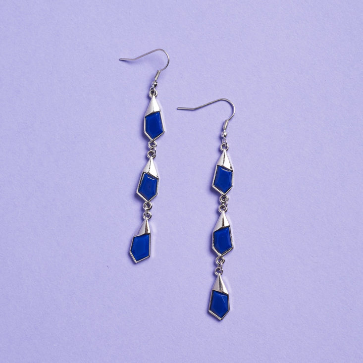 blue earrings laid flat