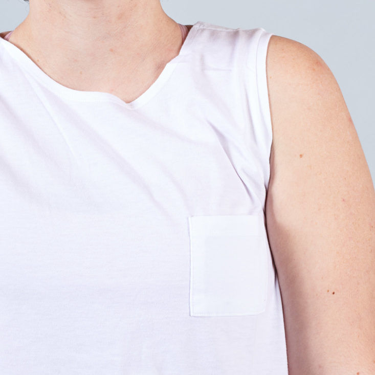 pocket detail on white tank