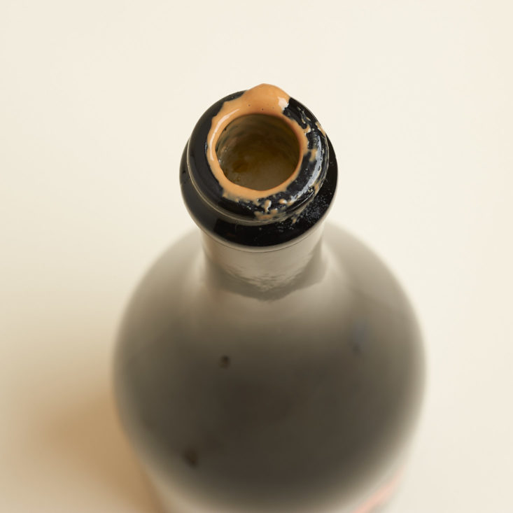 fermentation gloop on the mouth of a bottle