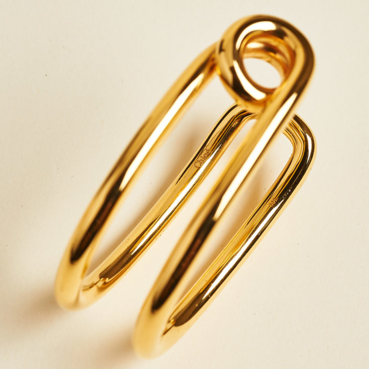 gold cuff bracelet on its side