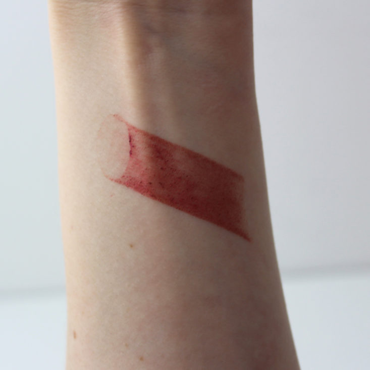 swatch of Jersey Shore Cosmetics Lip and Cheek Rouge in Red Hibiscus on wrist