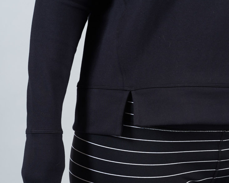 cutout hem of black sweatshirt