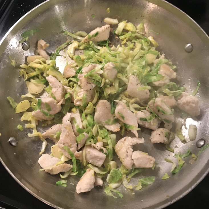 Once chicken is browned, add sprouts