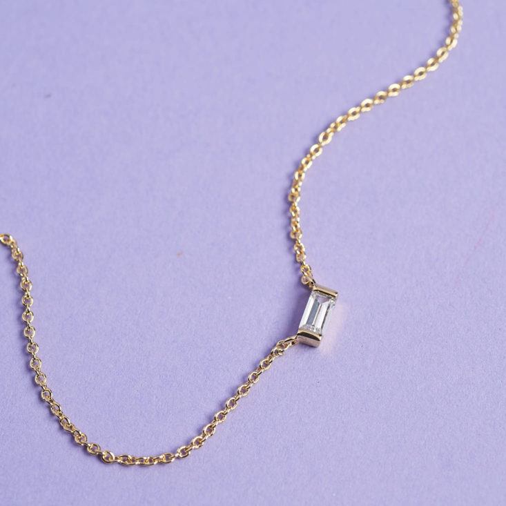 closeup on tiny crystal bar pendant