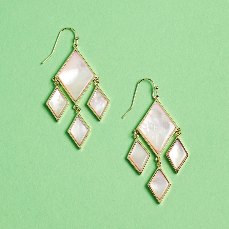diamond dangling earrings laid flat