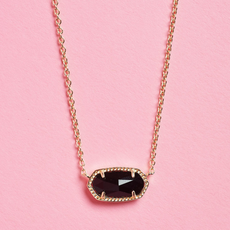 black charm at end of necklace
