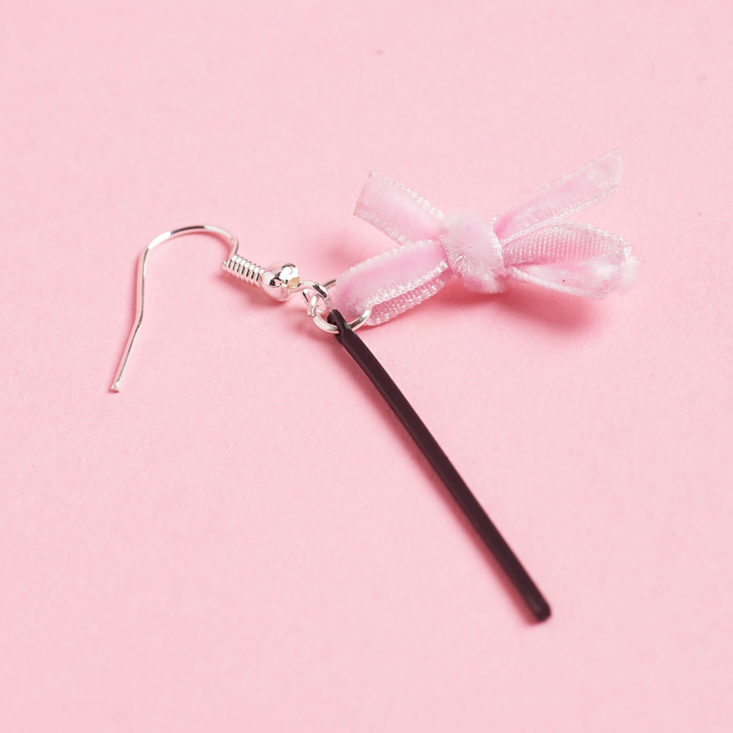 closeup on bow and stick earring