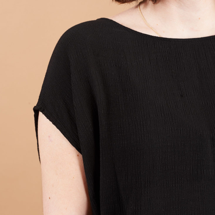 sleeve on black golden tote top