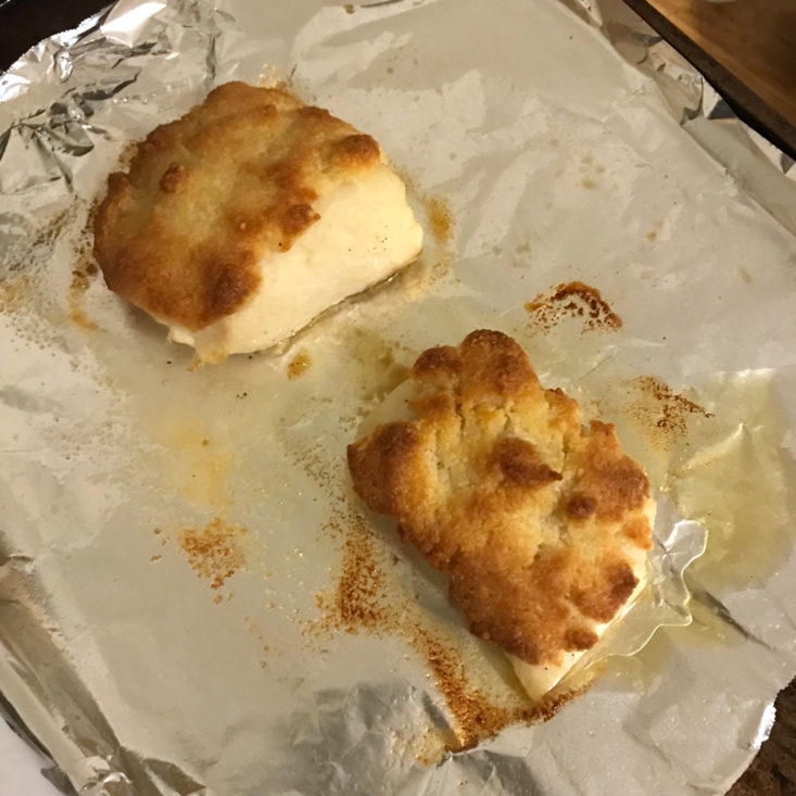 cooked cod on baking sheet