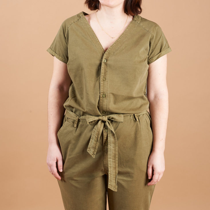 olive jumpsuit on model with tie belt