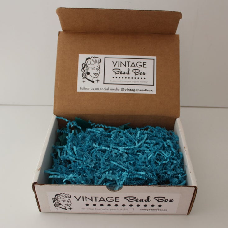 open Vintage Bead Box showing teal crinkle paper