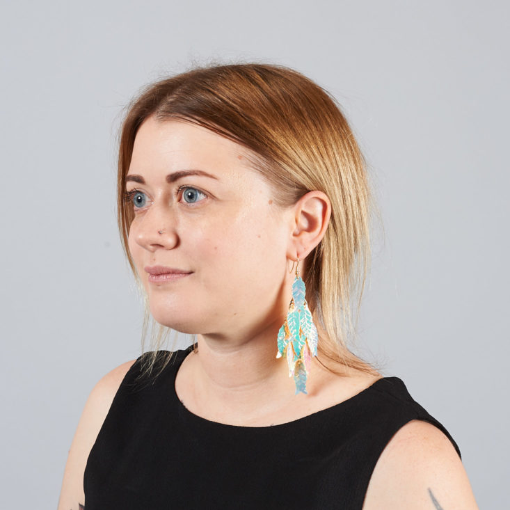 Iridescent Feather Earrings on model