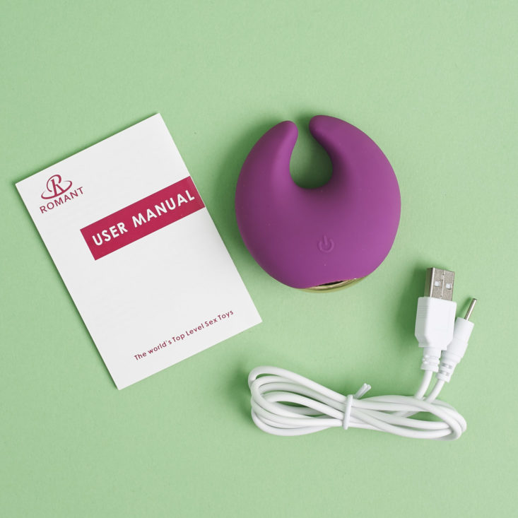 Romant Moon Vibrator with charging cord and manual