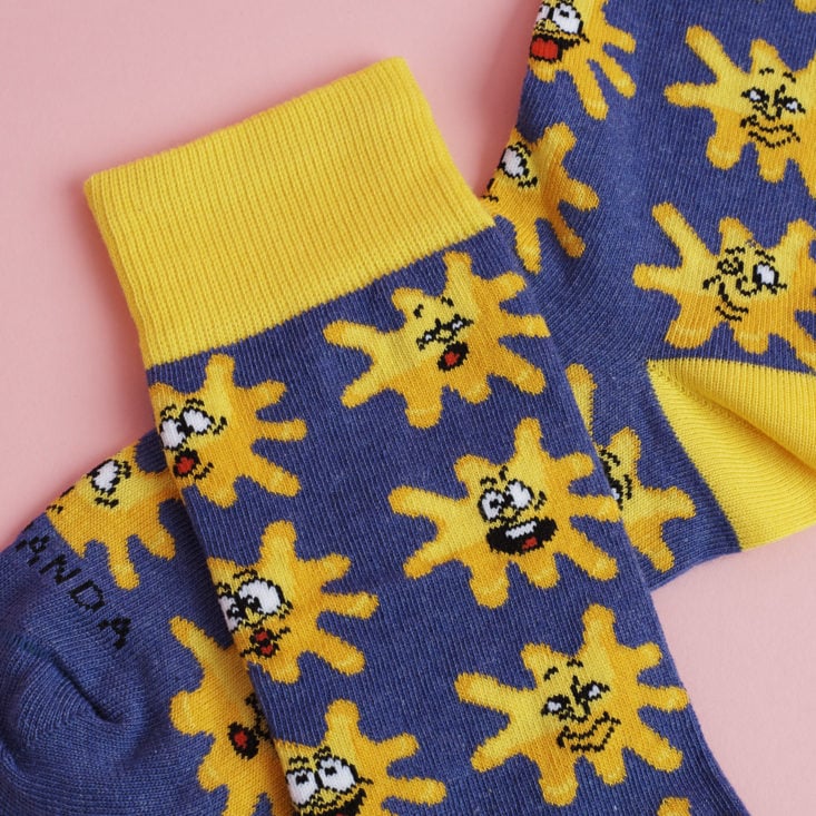 close up of blue and Yellow splat socks