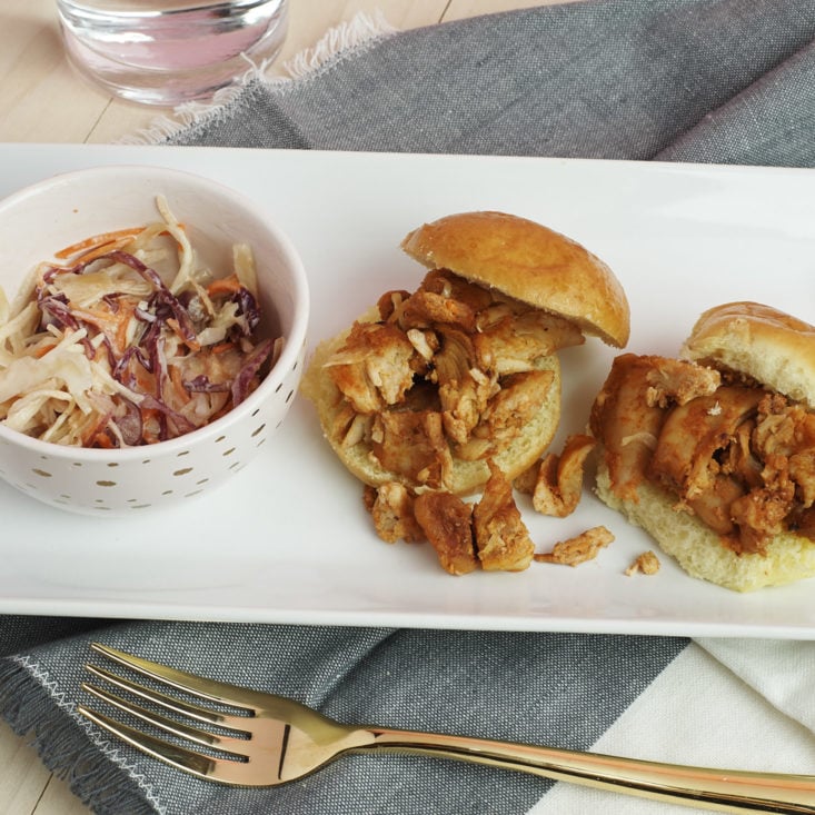 close up of plated BBQ Chicken Sliders on Brioche with Slaw