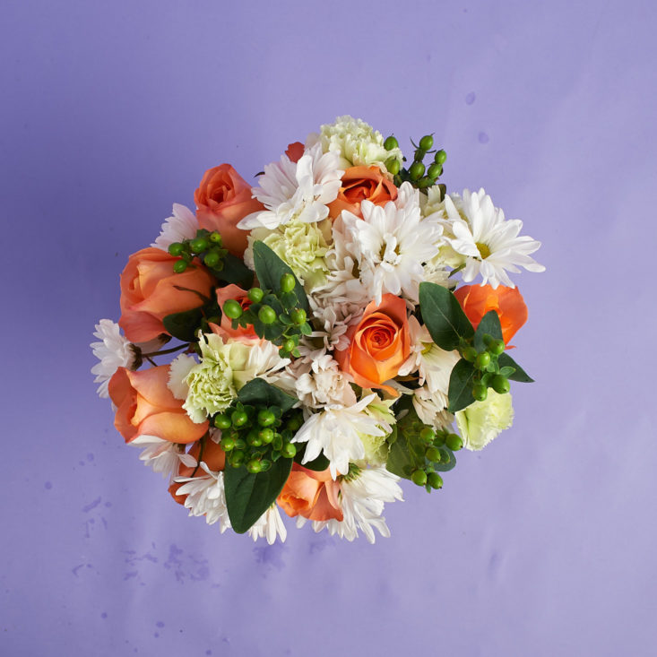 Overhead view of peach roses in vase