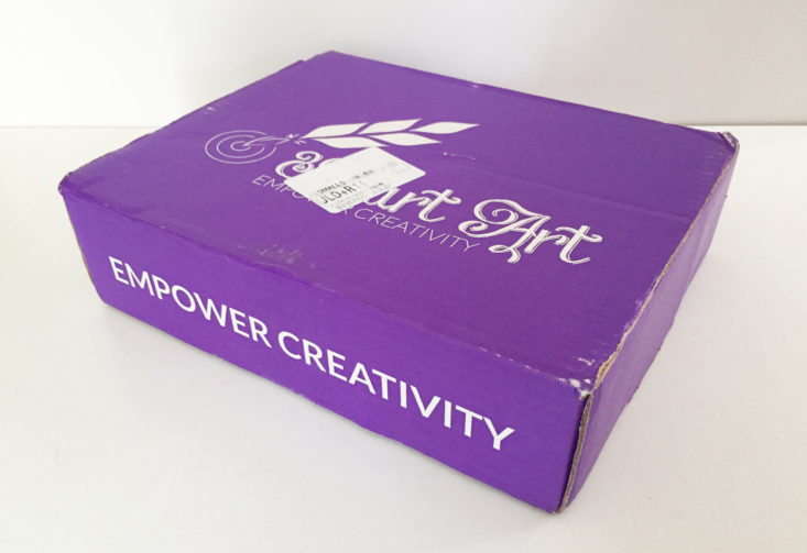 closed purple box with smart art printed on top