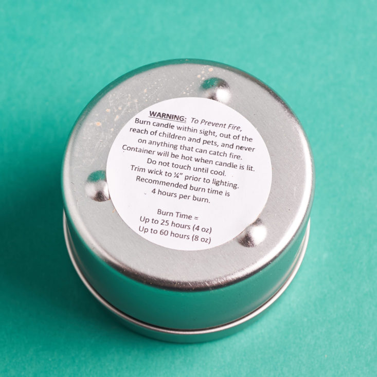 Kloverbox sticker on bottom of candle tin